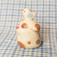Fancy Stump Dog Ceramic Figurine