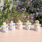 Fancy Stump Dog Ceramic Figurine